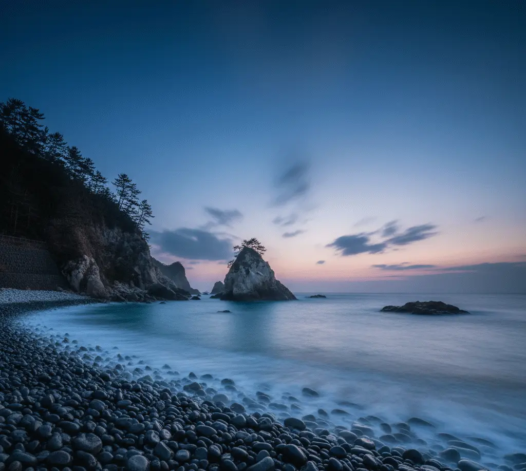 Unique black pebble beach and crystal-clear turquoise waves at Goishi Coast in Ofunato